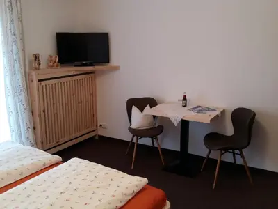 Ein Bett oder Betten in einem Zimmer der Unterkunft Gästehaus Pöppl