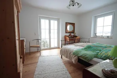 Ein Bett oder Betten in einem Zimmer der Unterkunft Kleines Schlösschen
