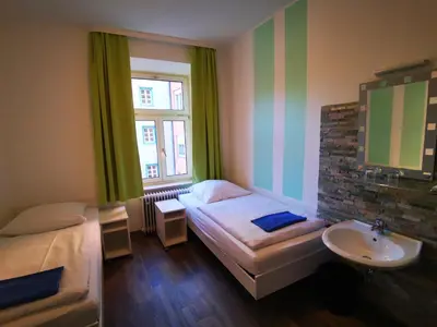 Ein Bett oder Betten in einem Zimmer der Unterkunft City Hostel