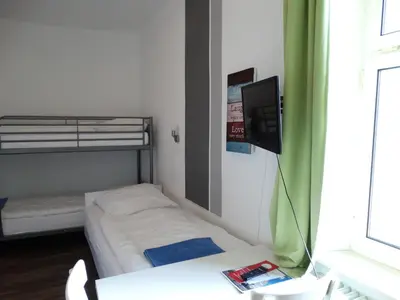 Ein Bett oder Betten in einem Zimmer der Unterkunft City Hostel