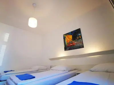 Ein Bett oder Betten in einem Zimmer der Unterkunft City Hostel