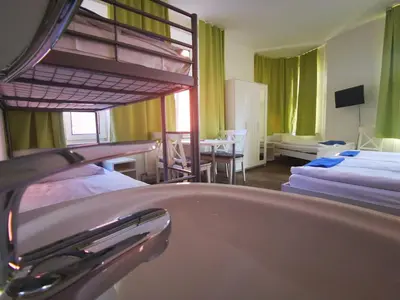 Ein Bett oder Betten in einem Zimmer der Unterkunft City Hostel