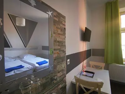 Ein Bett oder Betten in einem Zimmer der Unterkunft City Hostel