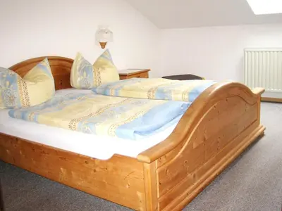 Ein Bett oder Betten in einem Zimmer der Unterkunft Familienapartment in Ingenried