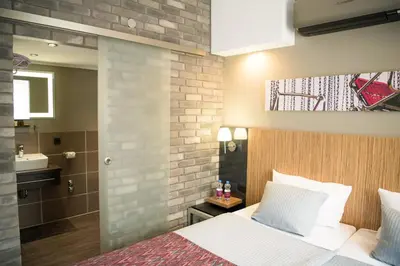 Ein Bett oder Betten in einem Zimmer der Unterkunft Hotel Munich City