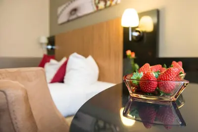 Ein Bett oder Betten in einem Zimmer der Unterkunft Hotel Munich City