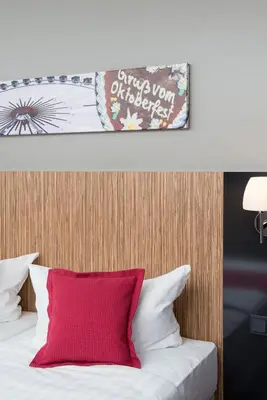 Ein Bett oder Betten in einem Zimmer der Unterkunft Hotel Munich City