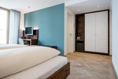 Ein Bett oder Betten in einem Zimmer der Unterkunft Griesbräu zu Murnau