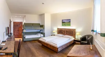 Ein Bett oder Betten in einem Zimmer der Unterkunft Griesbräu zu Murnau