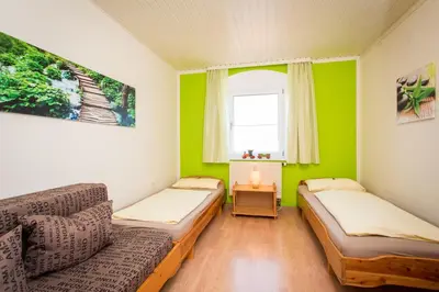Ein Bett oder Betten in einem Zimmer der Unterkunft Gästehaus Herb