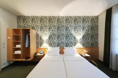 Ein Bett oder Betten in einem Zimmer der Unterkunft MOMA1890 Boutique Hotel