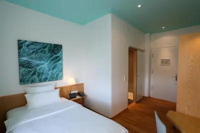 Ein Bett oder Betten in einem Zimmer der Unterkunft MOMA1890 Boutique Hotel