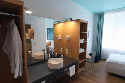 Ein Bett oder Betten in einem Zimmer der Unterkunft MOMA1890 Boutique Hotel