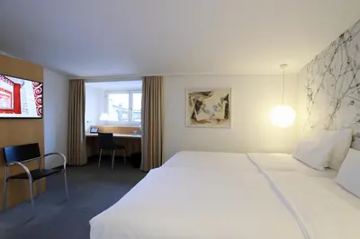 Ein Bett oder Betten in einem Zimmer der Unterkunft MOMA1890 Boutique Hotel