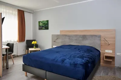 Ein Bett oder Betten in einem Zimmer der Unterkunft Zur Allacher Mühle