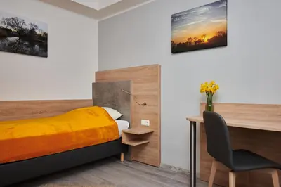Ein Bett oder Betten in einem Zimmer der Unterkunft Zur Allacher Mühle