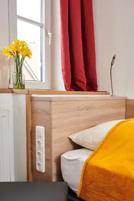 Ein Bett oder Betten in einem Zimmer der Unterkunft Zur Allacher Mühle