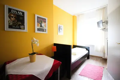 Ein Bett oder Betten in einem Zimmer der Unterkunft Hotel Pension am Hauptbahnhof