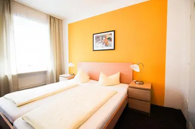 Ein Bett oder Betten in einem Zimmer der Unterkunft Hotel Pension am Hauptbahnhof
