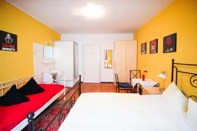 Ein Bett oder Betten in einem Zimmer der Unterkunft Hotel Pension am Hauptbahnhof