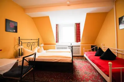 Ein Bett oder Betten in einem Zimmer der Unterkunft Hotel Pension am Hauptbahnhof