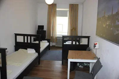 Ein Bett oder Betten in einem Zimmer der Unterkunft Hotel Pension am Hauptbahnhof