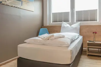 Ein Bett oder Betten in einem Zimmer der Unterkunft My Hostel