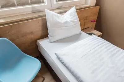 Ein Bett oder Betten in einem Zimmer der Unterkunft My Hostel