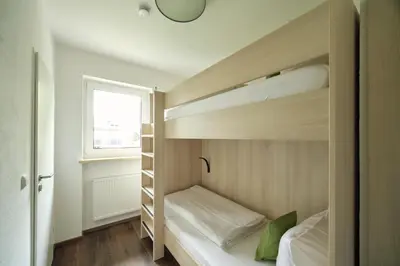 Ein Bett oder Betten in einem Zimmer der Unterkunft Marias Inn Hotel & Apartments Garching bei München