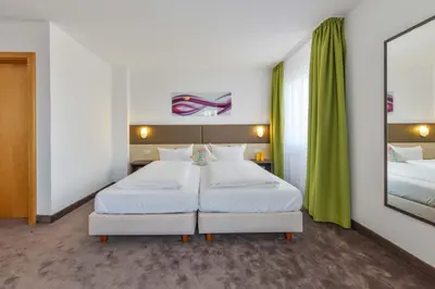 Ein Bett oder Betten in einem Zimmer der Unterkunft Hotel Günter