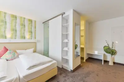 Ein Bett oder Betten in einem Zimmer der Unterkunft Hotel Günter