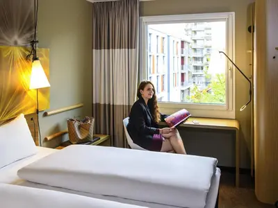 Ein Bett oder Betten in einem Zimmer der Unterkunft ibis Hotel Muenchen City West