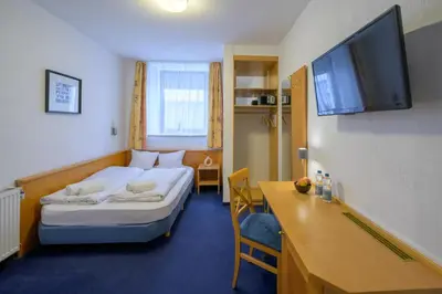 Ein Bett oder Betten in einem Zimmer der Unterkunft Hotel Pension Margit