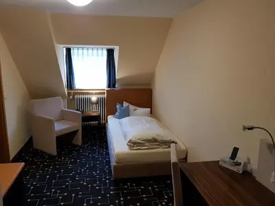 Ein Bett oder Betten in einem Zimmer der Unterkunft Hotel Königer