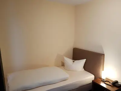 Ein Bett oder Betten in einem Zimmer der Unterkunft Hotel Königer