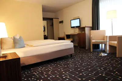 Ein Bett oder Betten in einem Zimmer der Unterkunft Hotel Königer
