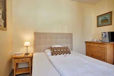 Ein Bett oder Betten in einem Zimmer der Unterkunft Hotel Zugspitze