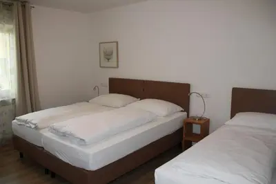 Ein Bett oder Betten in einem Zimmer der Unterkunft Pension Kellerer
