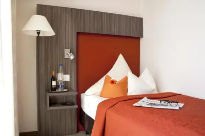 Ein Bett oder Betten in einem Zimmer der Unterkunft Hotel Linner
