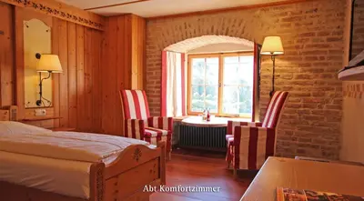 Ein Bett oder Betten in einem Zimmer der Unterkunft Irseer Klosterbräu