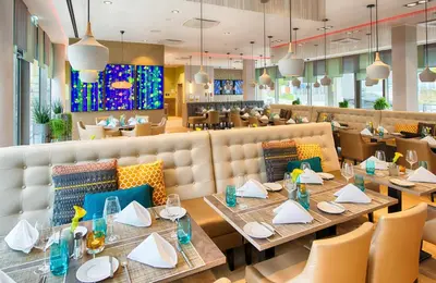 Ein Restaurant oder anderes Speiselokal in der Unterkunft Leonardo Hotel Munich City South