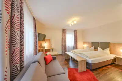 Ein Bett oder Betten in einem Zimmer der Unterkunft Hotel Gasthof Hainzinger