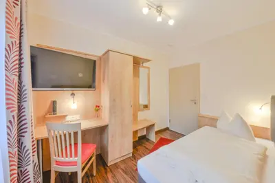 Ein Bett oder Betten in einem Zimmer der Unterkunft Hotel Gasthof Hainzinger