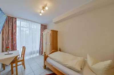Ein Bett oder Betten in einem Zimmer der Unterkunft Hotel Gasthof Hainzinger