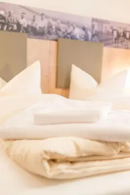Ein Bett oder Betten in einem Zimmer der Unterkunft Hotel Gasthof Hainzinger