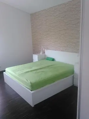 Ein Bett oder Betten in einem Zimmer der Unterkunft Ferienwohnung zum Kletterturm