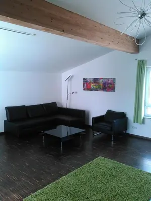 Ein Sitzbereich in der Unterkunft Ferienwohnung zum Kletterturm
