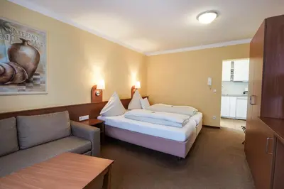Ein Bett oder Betten in einem Zimmer der Unterkunft Park Residence