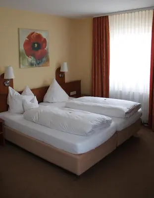 Ein Bett oder Betten in einem Zimmer der Unterkunft Park Residence