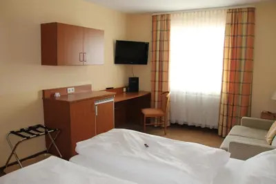 Ein Bett oder Betten in einem Zimmer der Unterkunft Park Residence